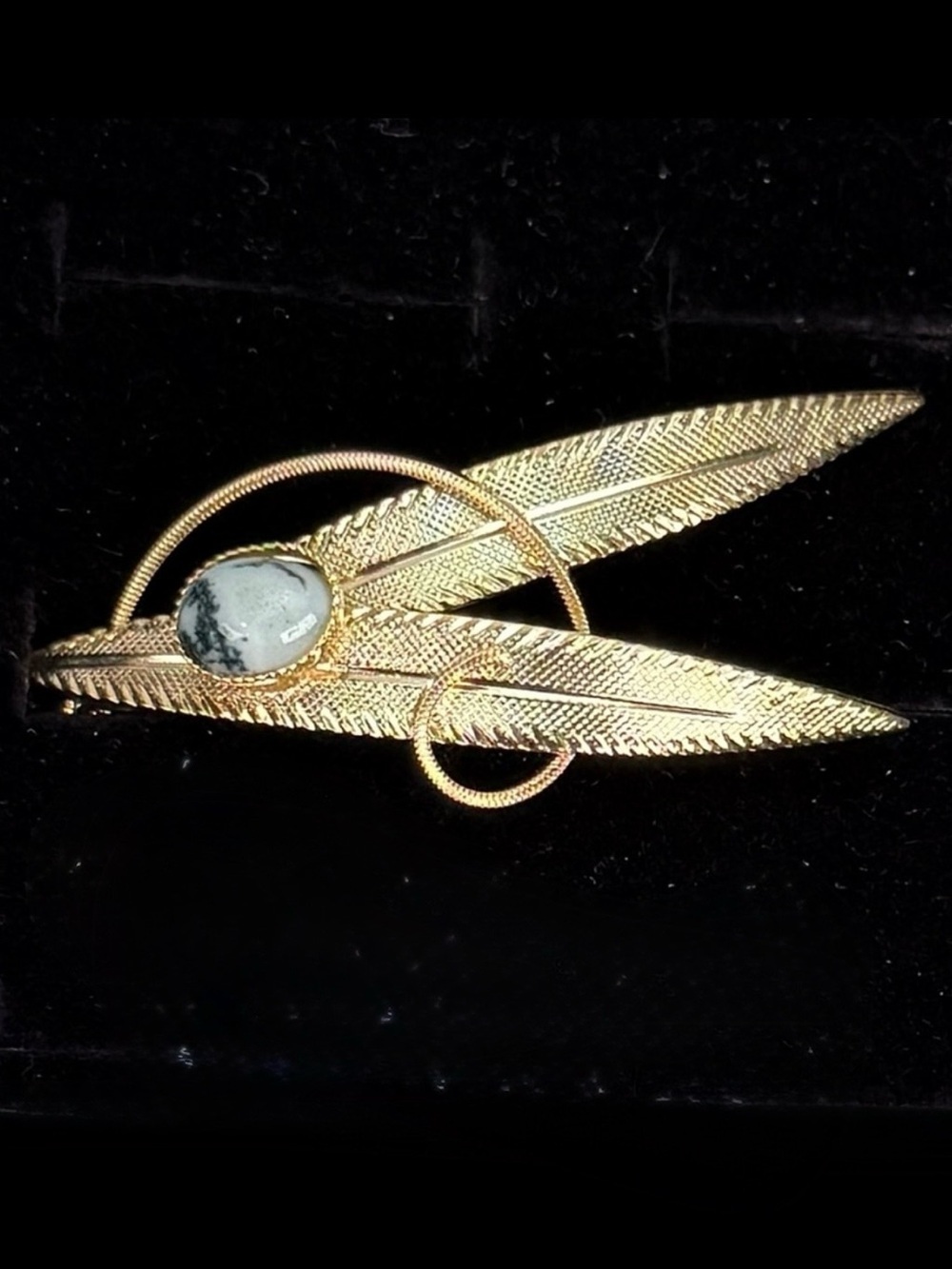 Elegant Goldtone Leaf Brooch with Colored Accent